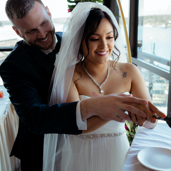 Couple cutting cake at wedding