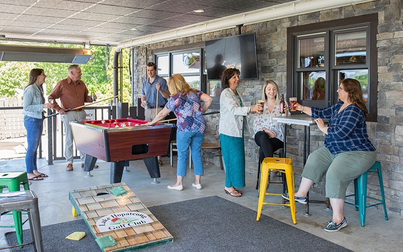 People playing pool  outside Big Fish Lounge