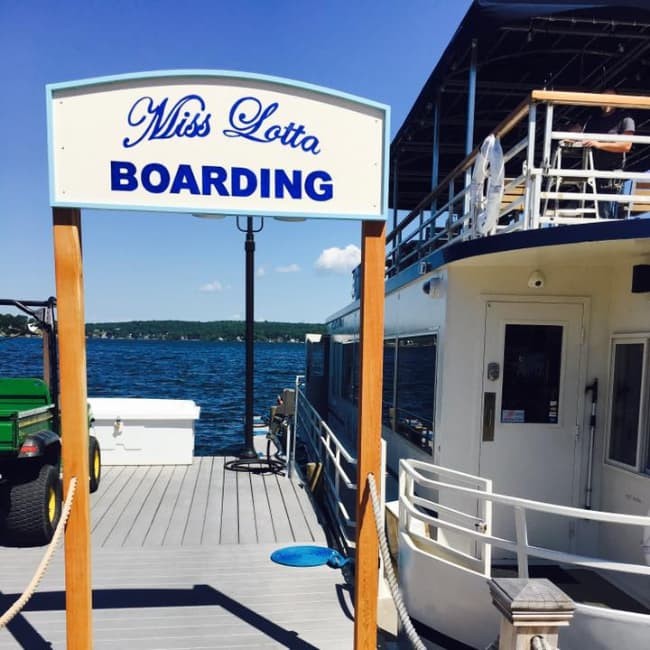 Miss Lotta Boarding sign on dock